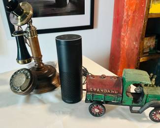 Replica working phone, with cords. Just needs a landline! Various Alexa speakers and vintage metal trucks. (We warned you it is an eclectic sale...)
