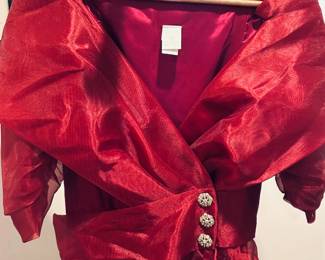 Vintage Watters & Watters dress Size 14 in as-new condition. Body is acetate. Lining is acetate.A similar dress, only with long sleeves is on Etsy for much more than we are selling it for.