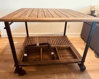 Beautiful solid-wood table ideal for crafters, quilters or sewers. Bottom shelf has option of using 4 metal spacers to store art supplies or bolts of fabric. Also has a removable tray. Large wheels. Lots of possibilities! 44" square and 35 inches high. Will need to be partially disassembled to get into elevator.