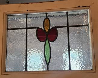 Framed stained glass window