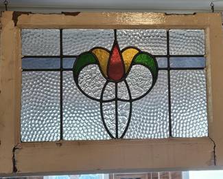 Framed stained glass window
