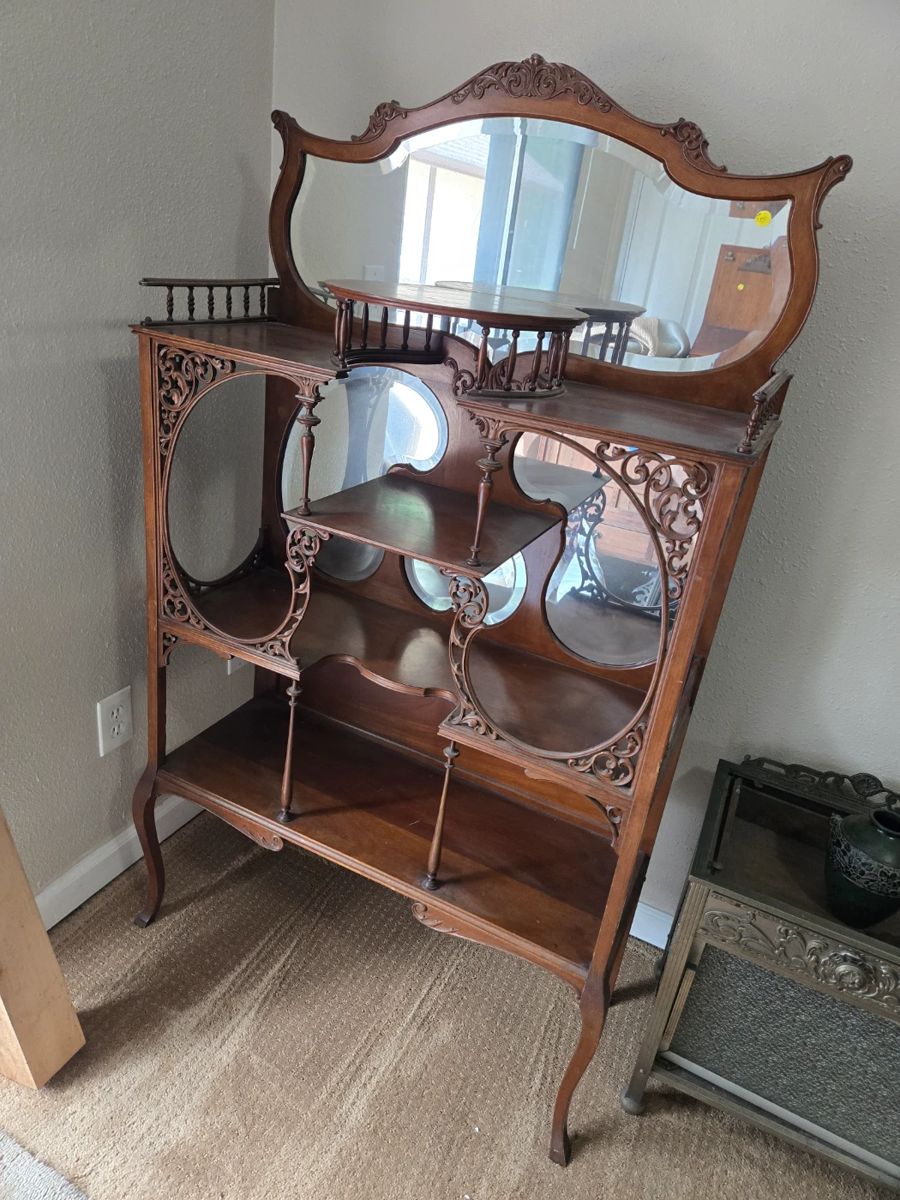 Exceptional ornate antique etagere with mirror.