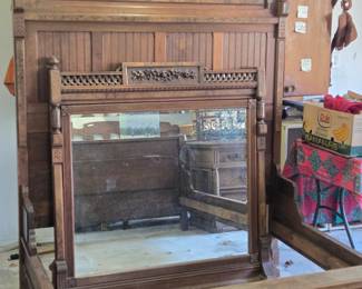 Antique carved wood bed/matching mirror.