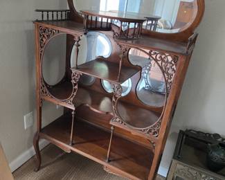Exceptional ornate antique etagere with mirror.