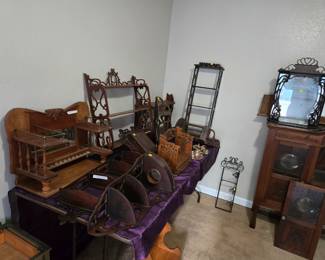 Many antique hanging wood shelves.