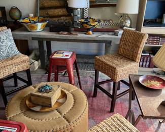 wood patio table with heavy metal base, West Elm herringbone mirror, Mexican pottery pieces