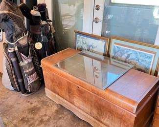 double door frame, cedar chest, golf clubs
