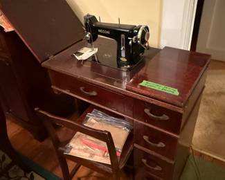 Necchi sewing machine in cabinet $80