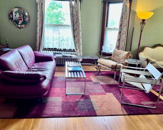 Area rugs, chrome slaters benches: one short and one long.