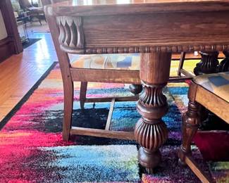 Solid oak antique dining room table with chairs, comes with 6 leafs so it can be small and square or extended very long!