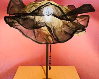 Fun & unique ‘Femme Fatale’ table lamp by Fire Farm. The shade is a triple petticoat shade made of wire mesh and comes with a jeweled pull chain