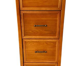 Wood filing cabinet. Comes with manual and keys.