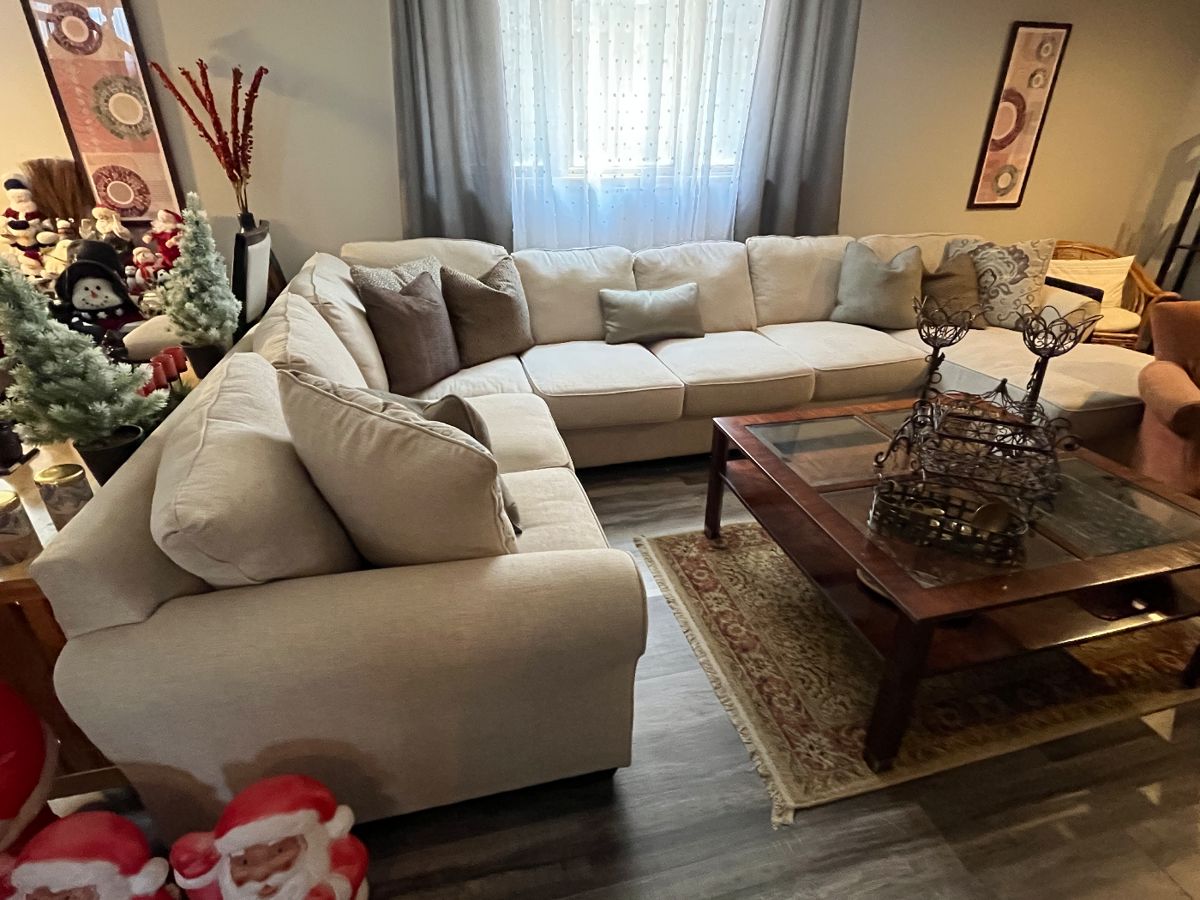 Upholstered sectional sofa with chaise......