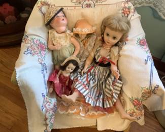 Vintage dolls and doll rocker. Measures 20 w x 20 d x 20h