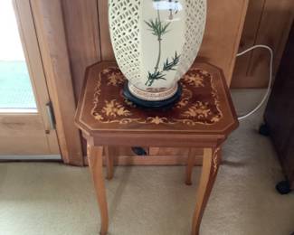 The handmade table measures 16” w x 13” d x 19” h. Oriental lamp on top
