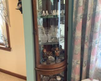 Corner curio cabinet measures 16” d x 22 w x 69” t. $150 presale. Has glass shelves