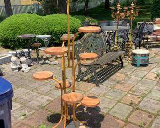 Metal plant stand with multiple wooden shelves