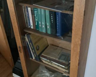 Older oak cabinet with glass door for display measures26 w x 12 d x 51 h. Also large collection of stamps