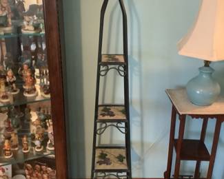 Wrought iron folding shelf with grape motif on shelves