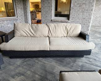 #44 All weather wicker with sunbrella fabrice sofa 88"L $100.00