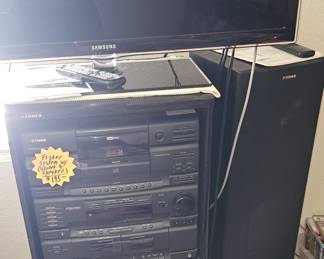 Fisher system in cabinet with 2 speakers