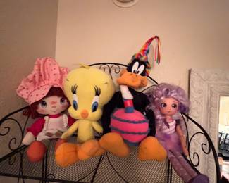 Strawberry shortcake Tweetie and a birthday celebrating Daffy duck plus some Rando purple haired doll that I don’t recognize