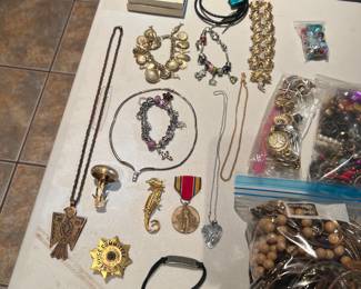 Mushroom broach is signed and by castlebrook I think. Copper thunderbird necklace is by… peyote bird trading post I believe. Badge is from service in Chicago abd dates 1939!