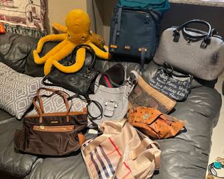 Pile of designer purses… Brands include but are not limited to Kate Spade Michael Kors Dooney and Bourke Makowsky & London fog