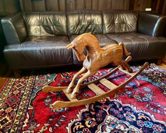 Hand carved wooden rocking horse.