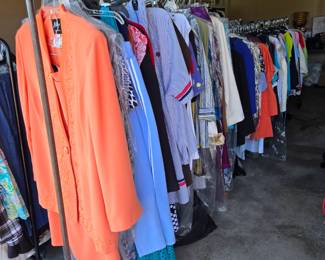 Racks and racks of WOMEN'S CLOTHING that have are in excellent condition.
