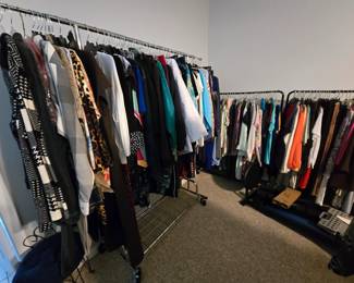 Racks and racks of women's clothing. Many new with tags!