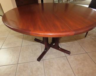 Rosewood table with extra leaves. Made in Norway.