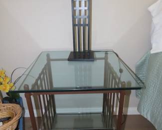 One of two glass/metal end tables.