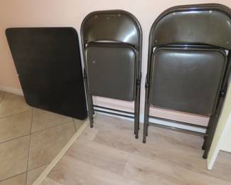 Folding games table and 4 folding chairs.