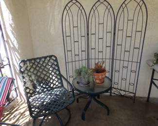 Swivel chair and iron candle screen.