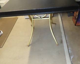 Two vintage black and gold folding tables.