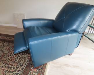 Blue leather pushback recliner. (Like new).