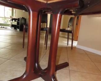 Rosewood table with extra leaves. Made in Norway.