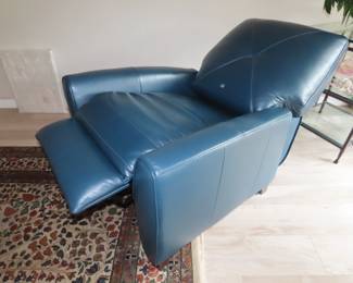 Blue leather pushback recliner. (Like new).
