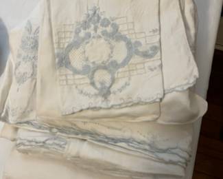 lots of antique and vintage linens and fabrics