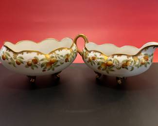 A pair of antique Limoges porcelain cream and sugar, hand painted with fruits