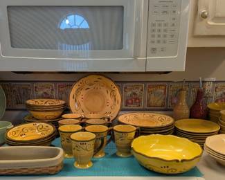 A BEAUTIFUL SET of Italian look pottery dishes.
