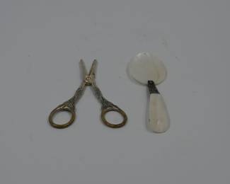 Vintage sewing scissors and shell spoon
