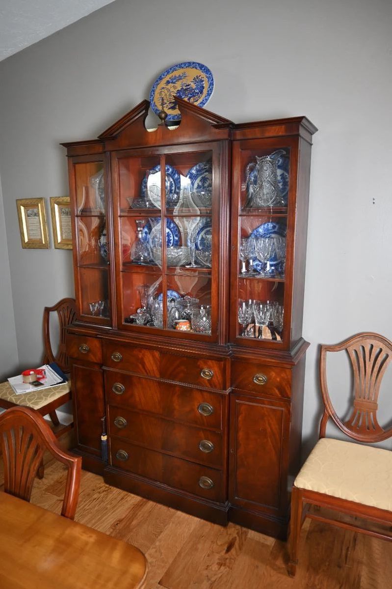 BEAUTIFUL mahogany breakfront china cabinet, produced by Saginaw Furniture Shops. This particular piece appears to be from the 1930s-1950s era. Saginaw Furniture Company was known for producing high-quality furniture, especially during this period.