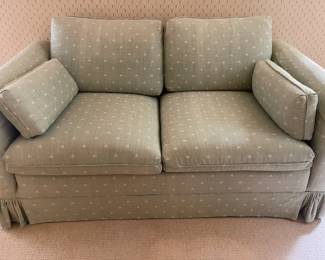 UPHOLSTERED SKIRTED LOVESEAT