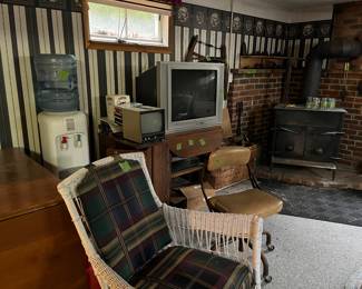tv's, water cooler, wicker chair, office chair