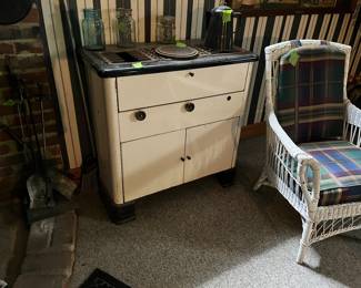 antique enamel stove, wicker chair