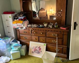 dresser, music boxes, storage totes, bed rail