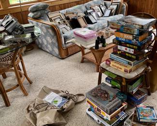 rattan sofa, coffee table, puzzles, picture frames, air mattress