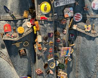 Many vintage pins on a Jordache Jean coat